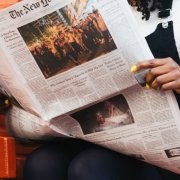 Woman reading The New York Times newspaper Woman reading The New York Times newspaper
