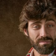 Man with blue eyes and beard looking directly at viewer Man with blue eyes and beard looking directly at viewer