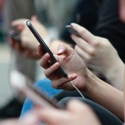 People looking at mobile phones People looking at mobile phones