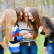 Teens looking at a phone Teens looking at a phone