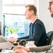 Web developers in front of their machines, coding Web developers in front of their machines, coding