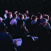People at an event gathering, sitting