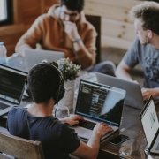 Office workers working at their desktops and looking at their computer screens, coding. Software jobs. Office workers working at their desktops and looking at their computer screens, coding. Software jobs.
