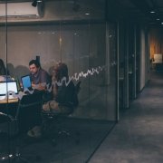 Startup people having a meeting in a glass room