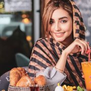 Consumer at the table with healthy food and drink Consumer at the table with healthy food and drink