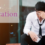 Crisis situation – a person sitting down with a hand to his head Crisis situation - a person sitting down with a hand to his head