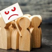 An Angry Mob Of Wooden Figures Of People With A Poster An Angry Mob Of Wooden Figures Of People With A Poster