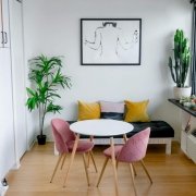 Airbnb room with a table and chairs around it and a cactus by the window Airbnb room with a table and chairs around it and a cactus by thh window