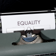 Word “equality” typed on a white paper still inside the typewriter Word "equality" typed on a white paper still inside the typewriter